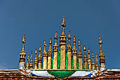 Wat Xieng Thong temple in Luang Prabang, Laos. The  flared  dok so fa   pointing at the sky  the uniquely Laotian roof ornament consisting of 17 miniature stupas covered by tiered parasols. 